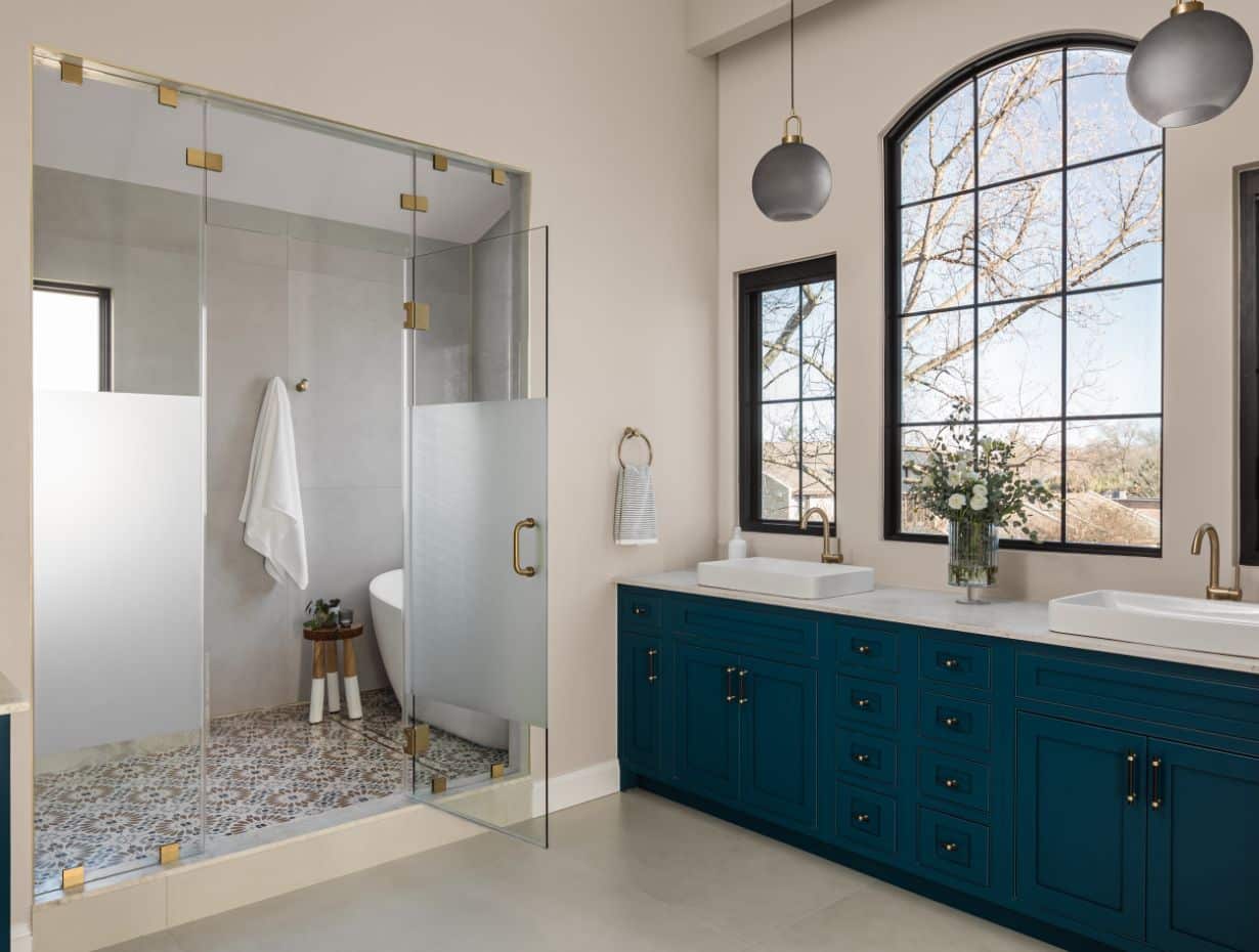 A luxury bathroom with gold fixtures installed by Sage Construction in Fairfax VA
